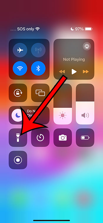 tap the flashlight button